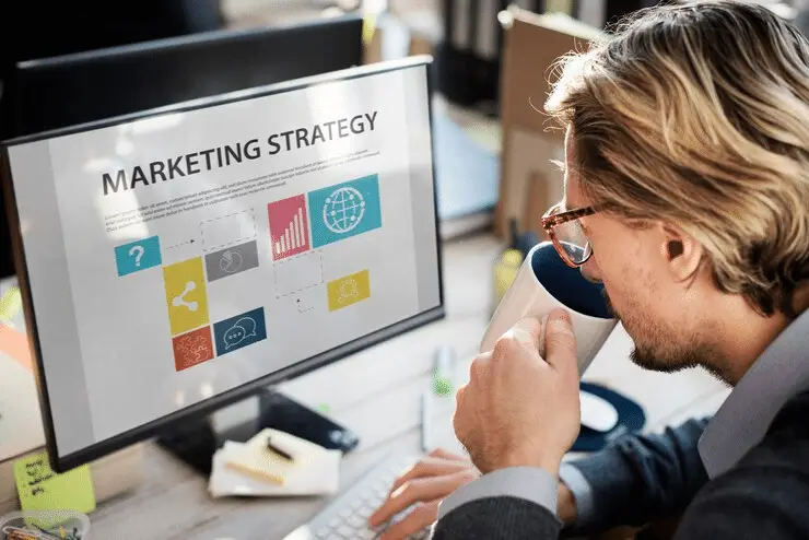 advertising consultant crafting a PPC campaign strategy on a desktop